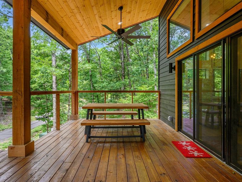 Embracing the great outdoors from our deck, where the only soundtrack we need is the rustling of leaves and chirping of birds.