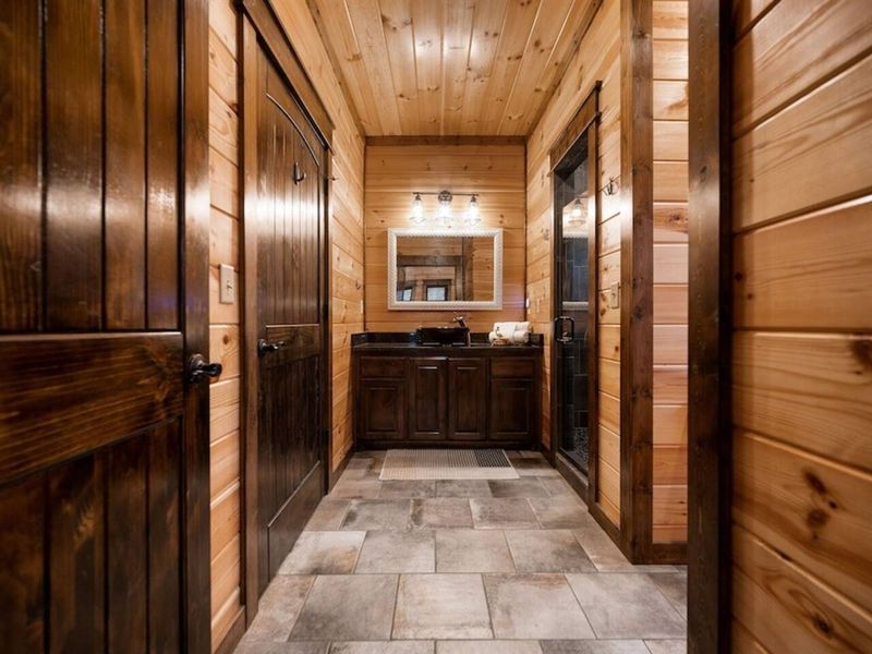 Bathroom ensuite to bedroom #2, accessible to hallway for convenience.
