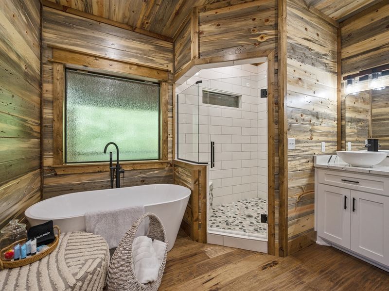 "Step into relaxation with the chic amenities of our en-suite oasis."