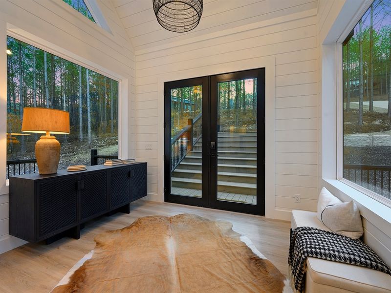 This inviting entry nook blends modern design with cozy cabin charm, creating the perfect welcome to your stay.