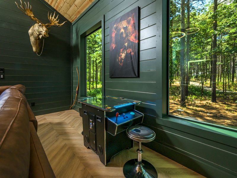 Play a few rounds while enjoying beautiful views of the surrounding trees through the expansive windows.
