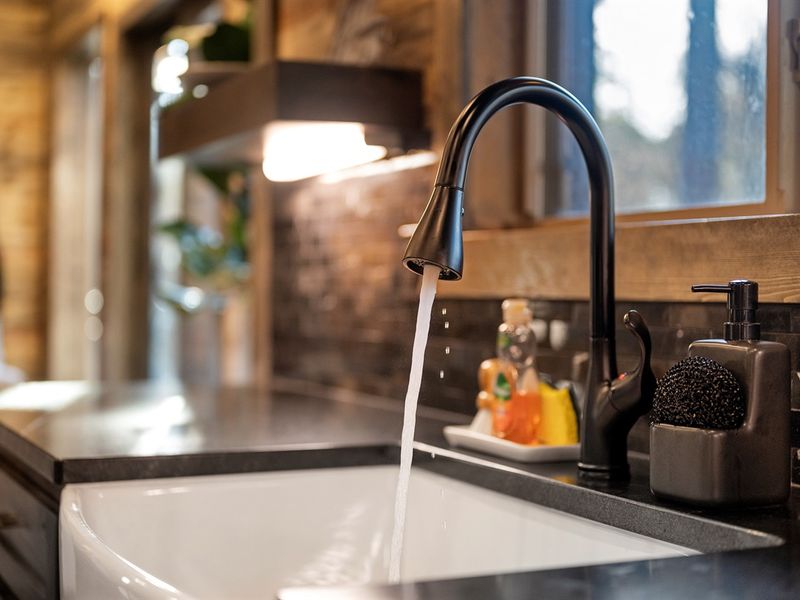 A farmhouse sink with a forest view — washing dishes never looked so good.