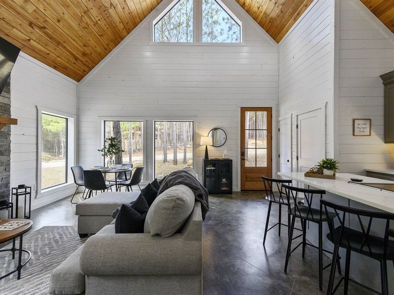 Experience modern luxury in our open-concept cabin, where natural light and elegant decor welcome you home.