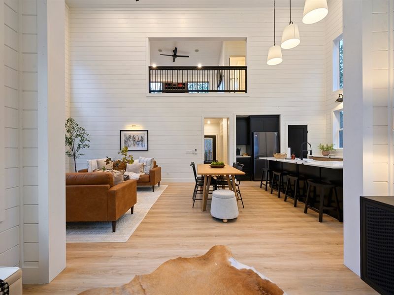 Contemporary lighting and curated finishes give the kitchen a sophisticated yet cozy cabin vibe.