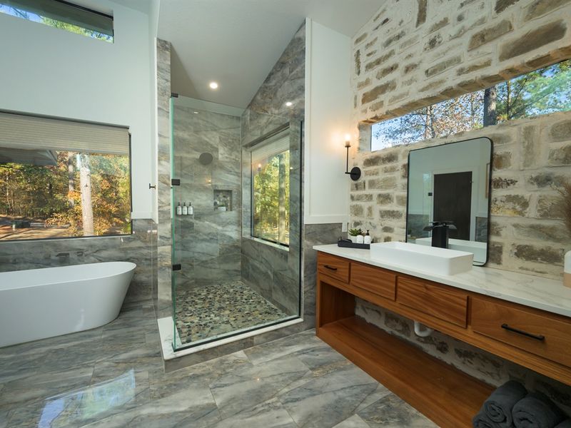 spa-inspired bath with freestanding soaking tub and oversized walk-in shower