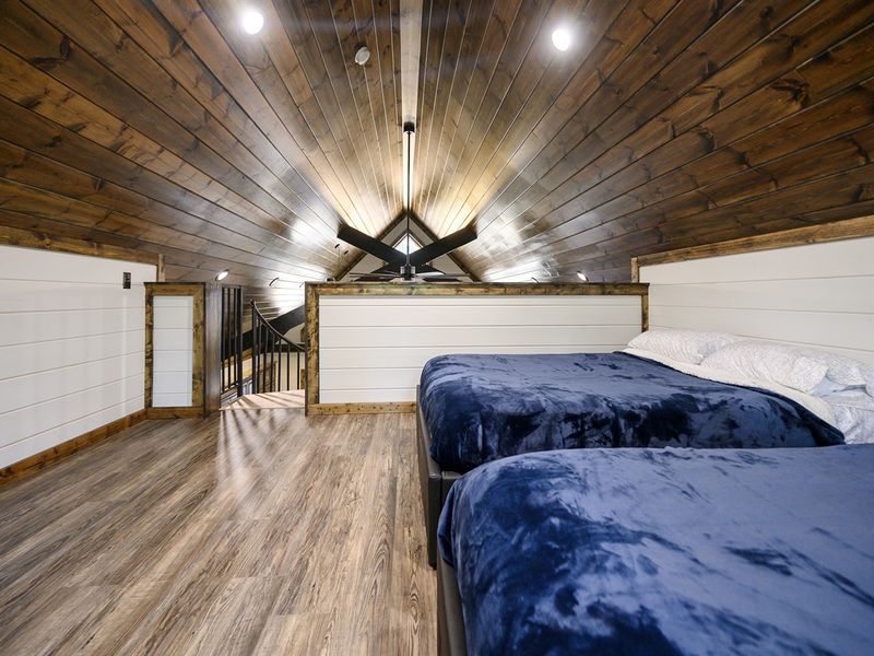 2 Full size beds and a tv upstairs