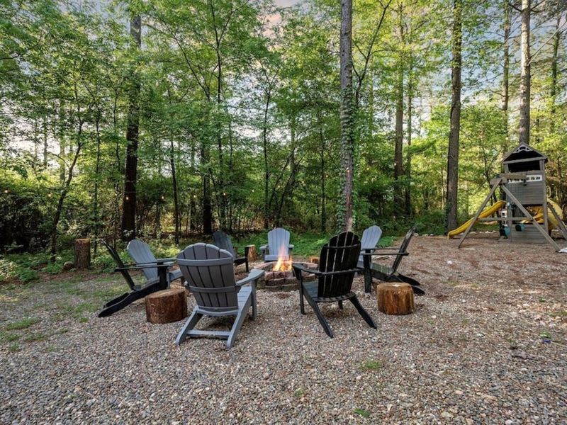 Warm up by a campfire with friends/family while the children play