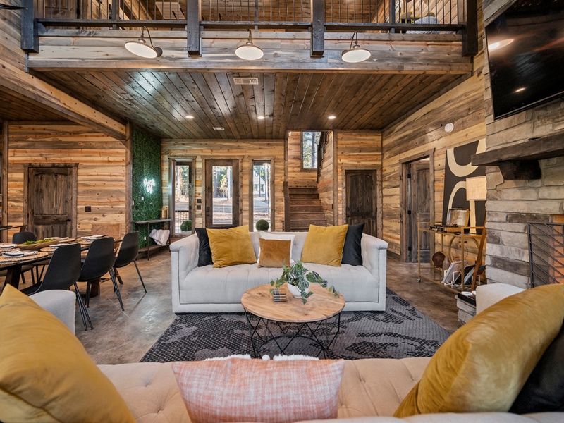 Large windows fill the space with natural light and peaceful forest views.