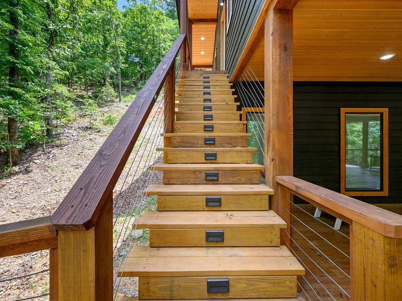Step into a fairytale. Follow the winding wooden pathway through the enchanting woods to reach our cozy cabin in the heart of nature.