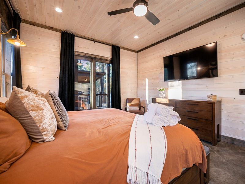 Thoughtfully designed king bedroom blending modern comfort with charming cabin vibes.