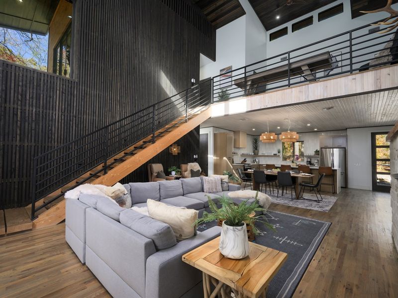 Open-concept living at its finest—soaring ceilings, modern architecture, and a seamless flow from lounge to kitchen