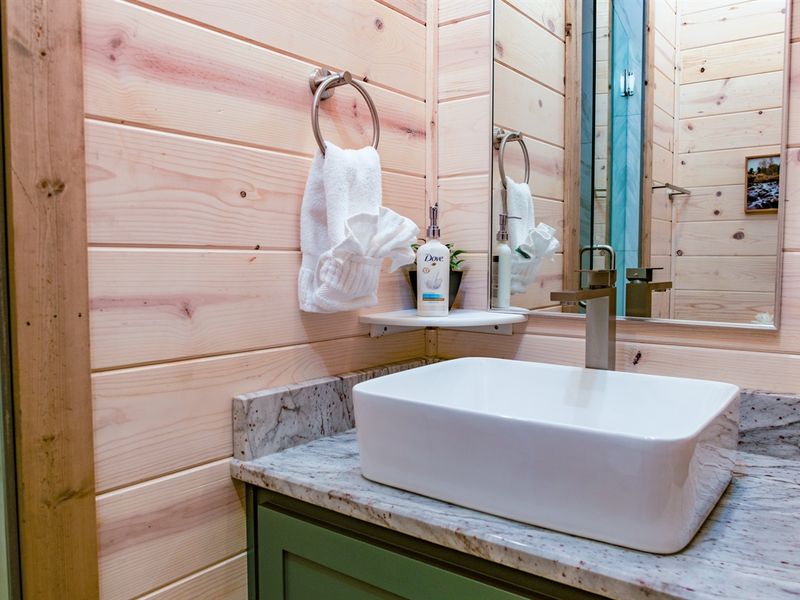 Sleek sink, spotless mirror, and endless style. King Bedroom 2 ensuite bathroom