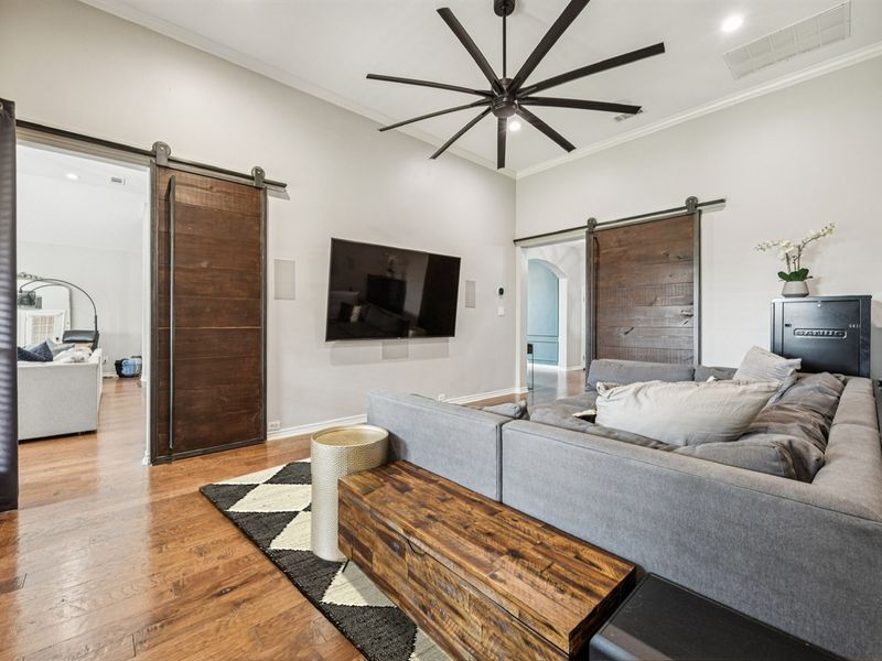 Barn doors create privacy for the ultimate cinematic experience.