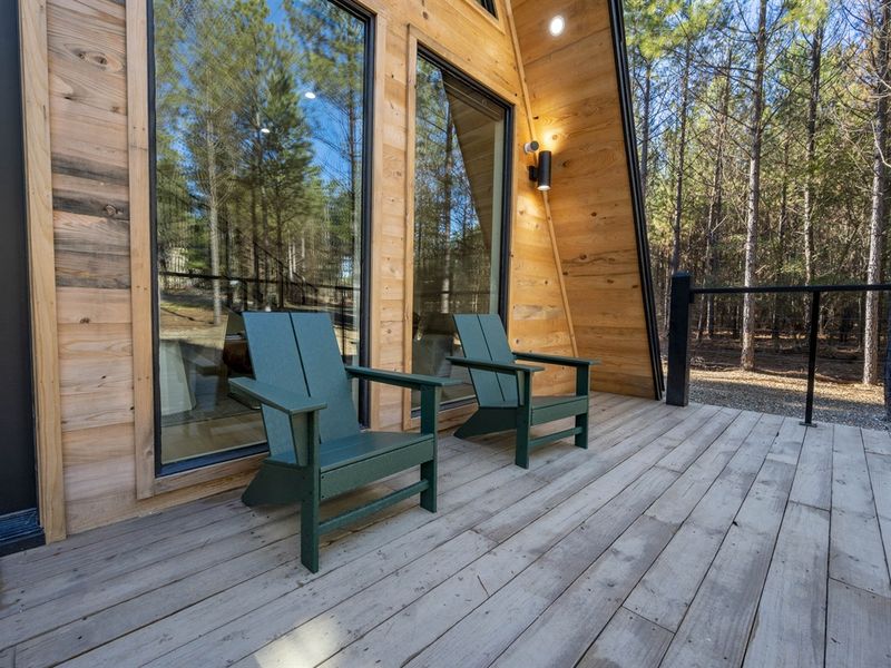 "Find tranquility in the shadows: A contemporary retreat among towering pines."