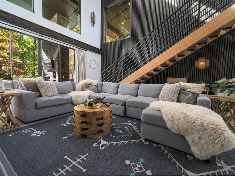 Open, airy, and inviting—this living space blends bold design with warm cabin comfort