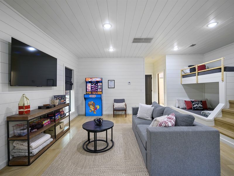 The kids' loft offers a whimsical play space, complete with games and books.