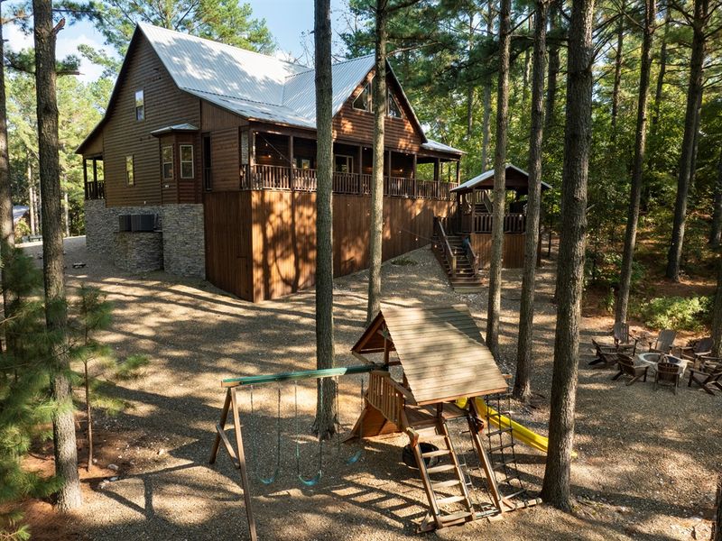 Surrounded by tall pines &mdash; outdoor fun and cabin living combined