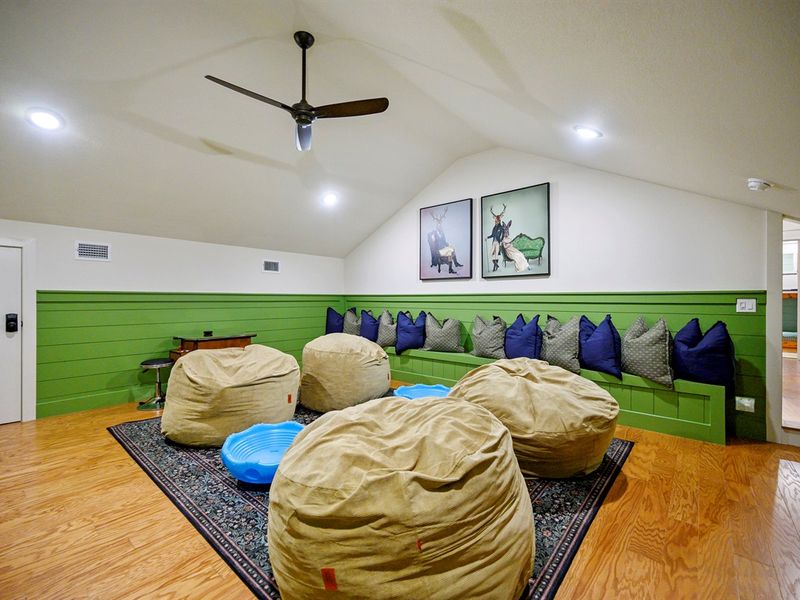 Kick back, relax, and let the good times roll in this comfy cabin game room.