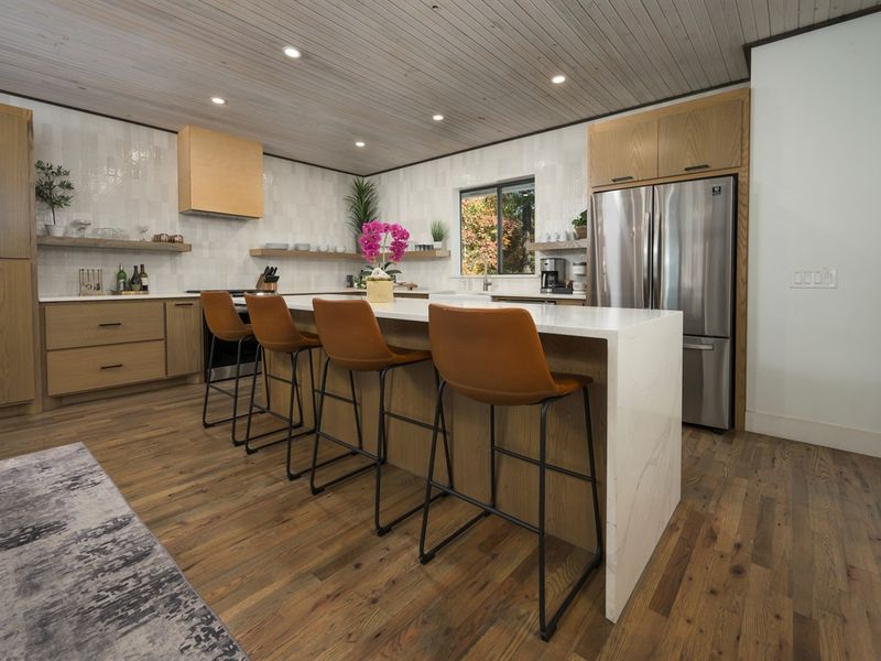 The heart of the cabin—cook, sip, and gather around this spacious kitchen island designed for togetherness