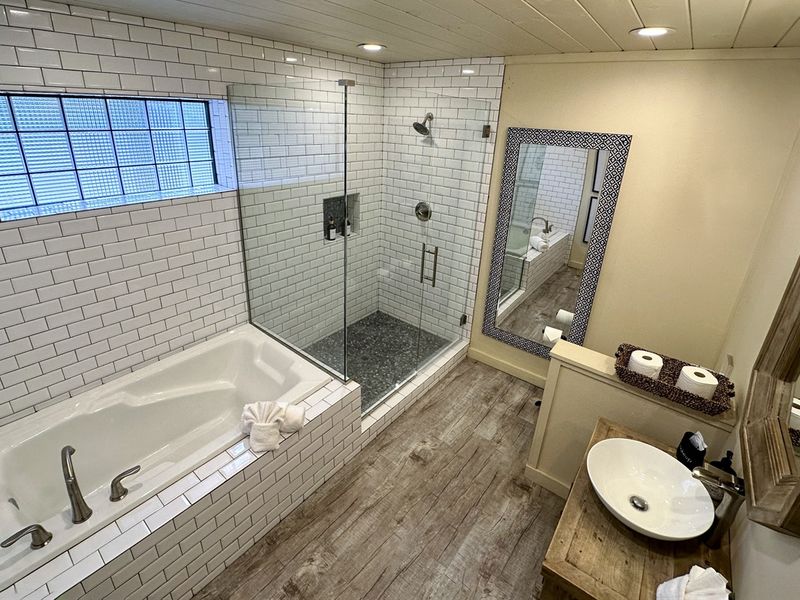 Inviting bath and shower combo in a modern bathroom.