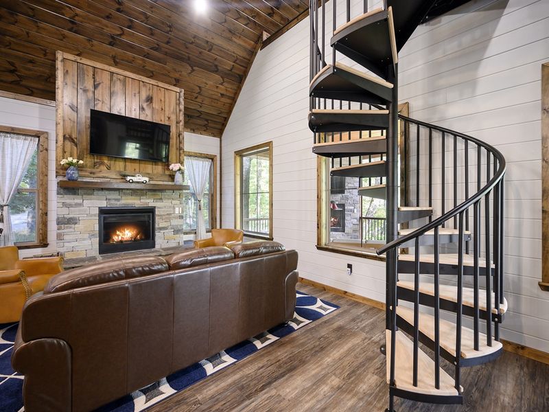 Ascend to adventure with our charming spiral staircase leading to the enchanting loft. Discover a cozy hideaway nestled among the treetops.