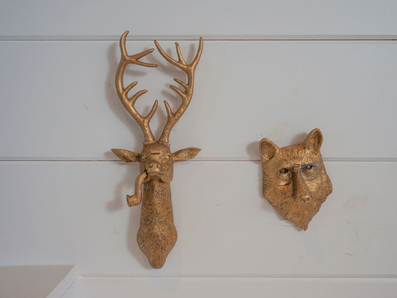 Rustic touches throughout the cabin, including these distinctive woodland-inspired accents, bring the outdoors in.