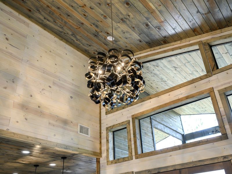 Discover the allure of this wood-ceilinged living room-- a haven of comfort and serenity.