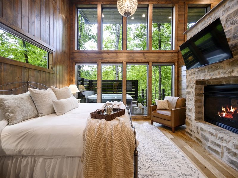 Indulge in luxury in our primary bedroom featuring a double-sided fireplace and a luxurious ensuite bathroom. Relax and unwind in style !