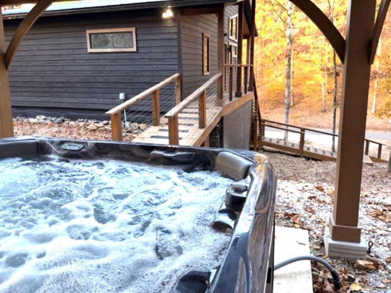 Your own secluded hot tub retreat, just steps from the cabin — warm, peaceful, and wrapped in nature