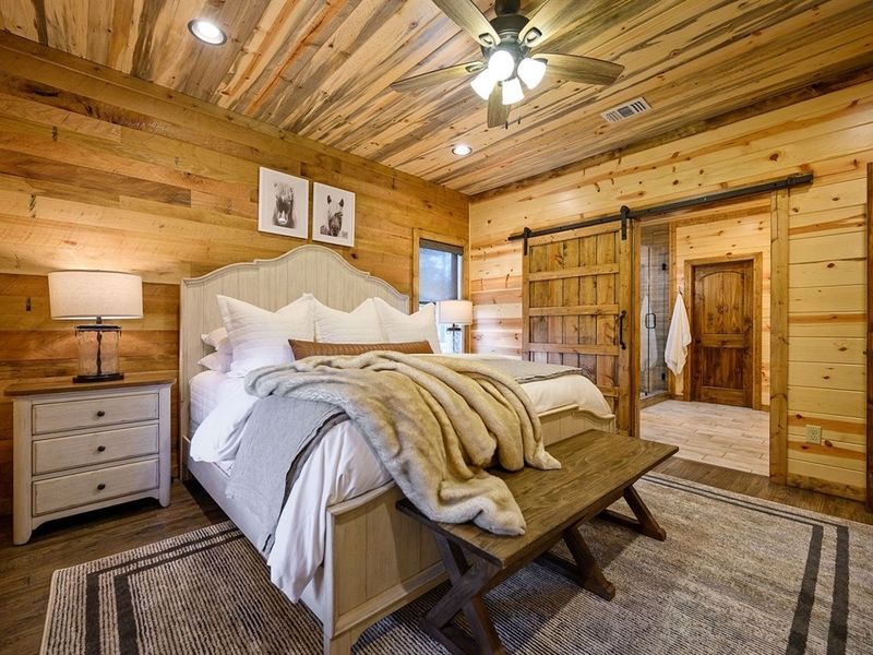 A peaceful master retreat with warm wood tones and plush comfort