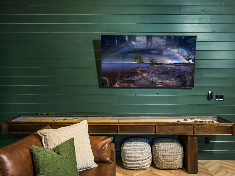 Kick back on the leather sectional and enjoy your favorite shows or movies on the large-screen TV.