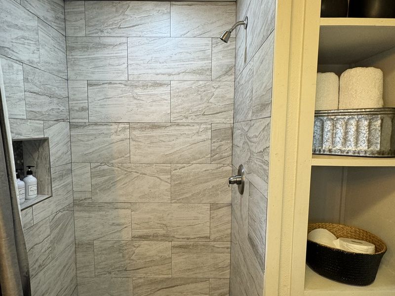 Sleek and chic shower area with bathroom essentials