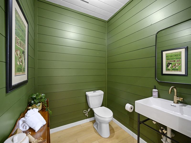Our chic 1/2 bathroom: where functionality meets style in compact elegance.