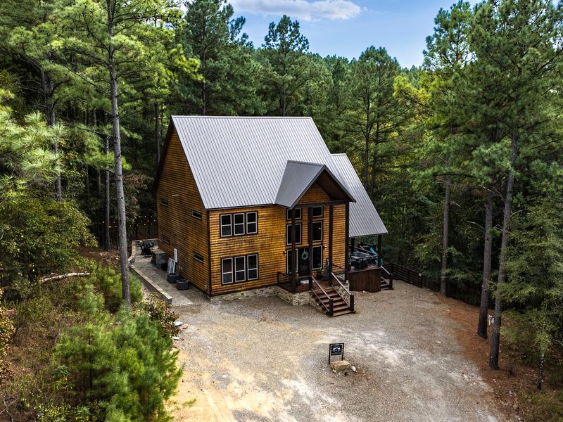 Nestled in the woods, this cozy cabin is the perfect getaway for some much-needed relaxation!
