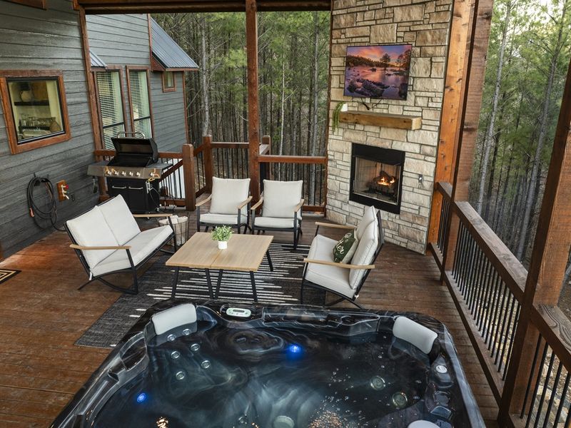 cabin , complete with a stunning outdoor space for dining and lounging.