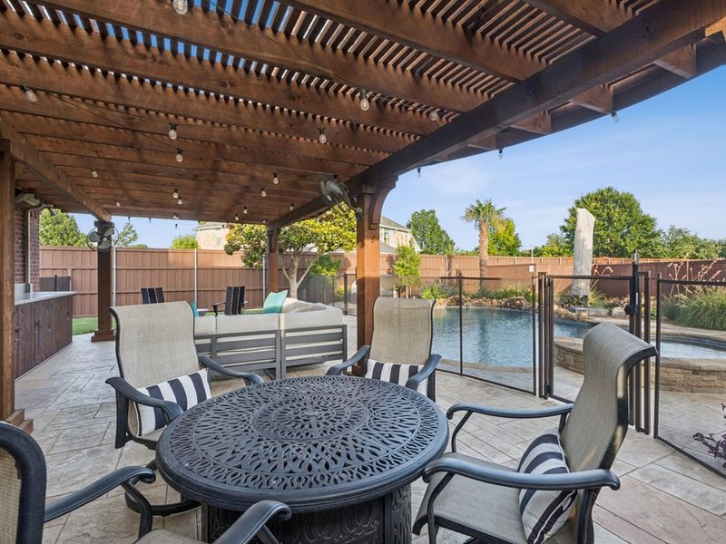 Alfresco dining with a view of your private backyard oasis.