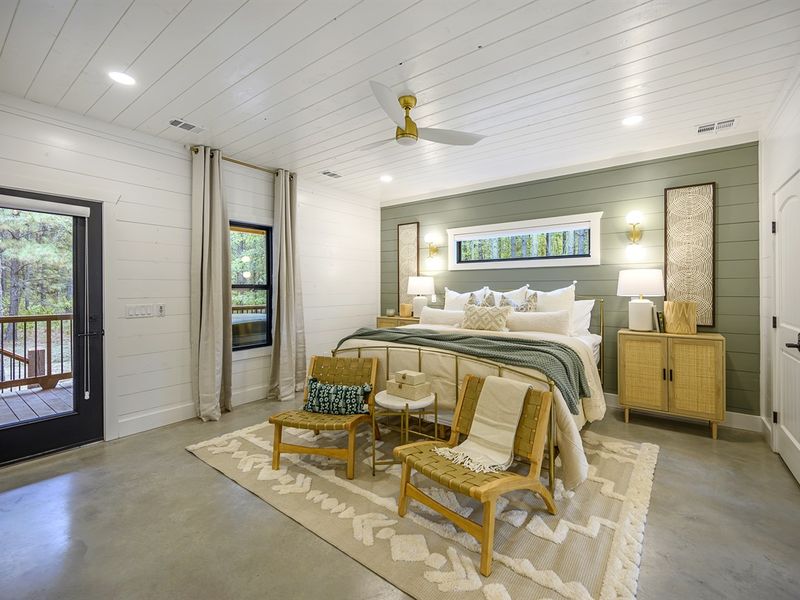 King bedroom 1 with comfortable bedding and access to the porch.