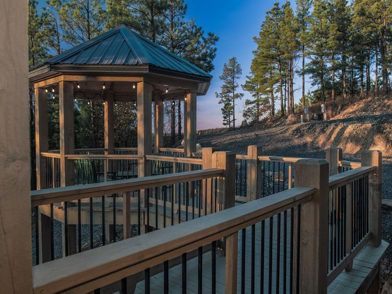 A walkway that feels like a fairytale, ending in a gazebo dream.