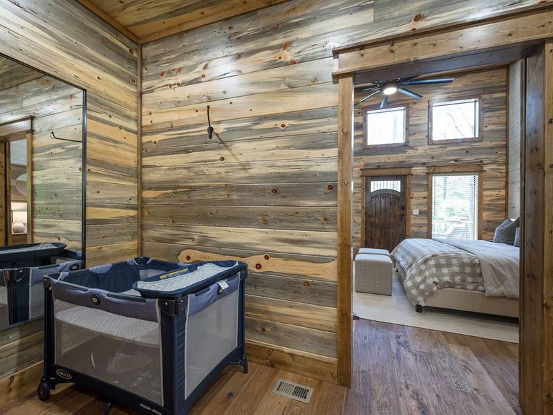 "Convenience meets comfort in our kid-friendly zone with a secure and cozy pack and play, ensuring little guests sleep tight."