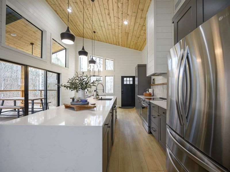 Luxury Kitchen Goals: Stunning waterfall island, high-end finishes, and all you need for a chef-inspired stay.