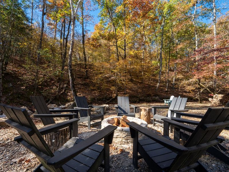 This is where nights slow down—pull up a chair, light the fire, and enjoy peaceful moments in the woods