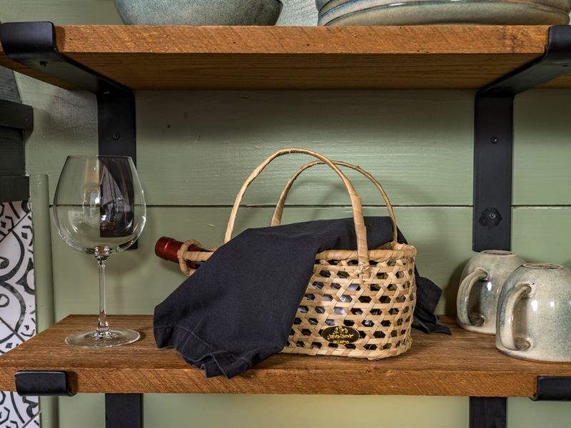 A quiet moment waiting to happen — pour a glass, slow down, and settle into the comfort of the cabin.