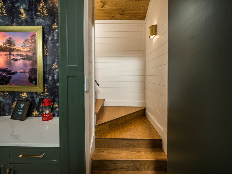 Follow the wood staircase to discover more of this beautifully appointed retreat.