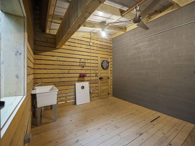 Below deck game room, complete with an enclosed outdoor shower - perfect for rinsing off after a day spent at Broken Bow Lake