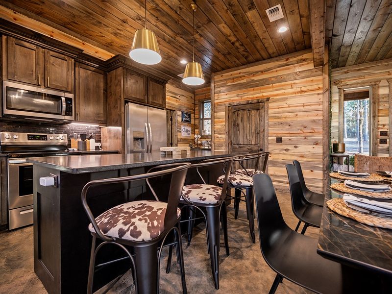 Rustic charm meets modern convenience in this fully equipped kitchen.