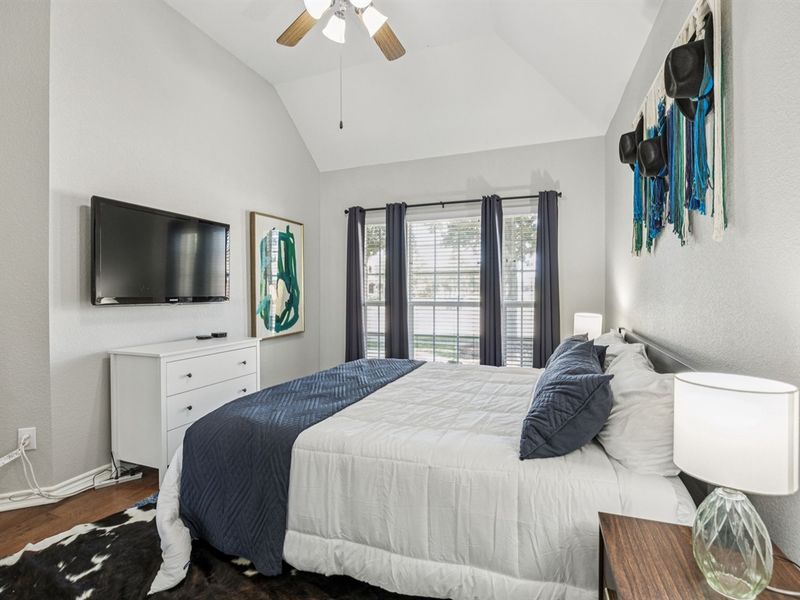 Cozy room with ample light and a 40” Apple TV for easy streaming.
