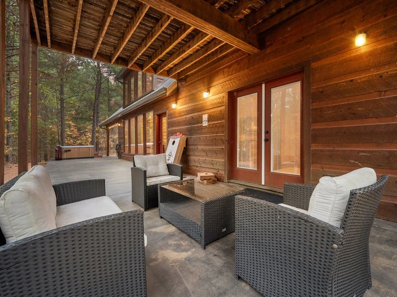 The second lounge area is the perfect spot to enjoy some private time with your morning coffee just steps from the forest.