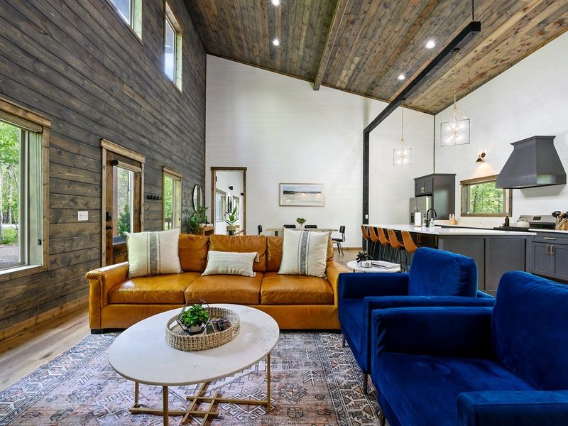 Entertain in Grandeur: Open-concept living room, dining, and kitchen area are perfect for family fun