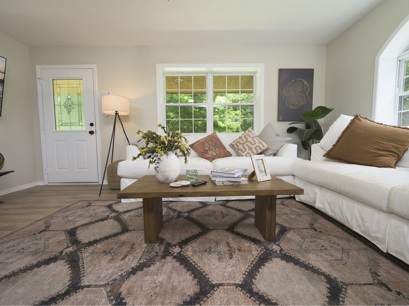 Natural light floods the living room, creating a perfect gathering space.