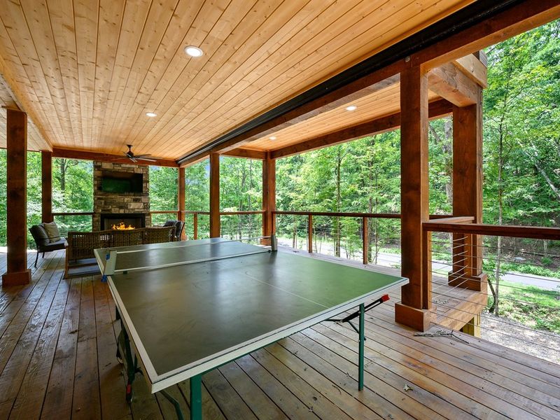 Outdoor Lounge: Challenge friends to ping pong with nature as your backdrop on this spacious deck!